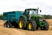 Joh Deere 7530 Premium tractor and trailer loaded with wheat