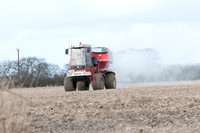 Spreading lime on a field prior to planting