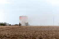 Spreading lime on a field prior to planting