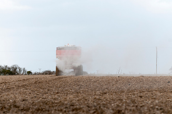 Spreading lime on a field prior to planting